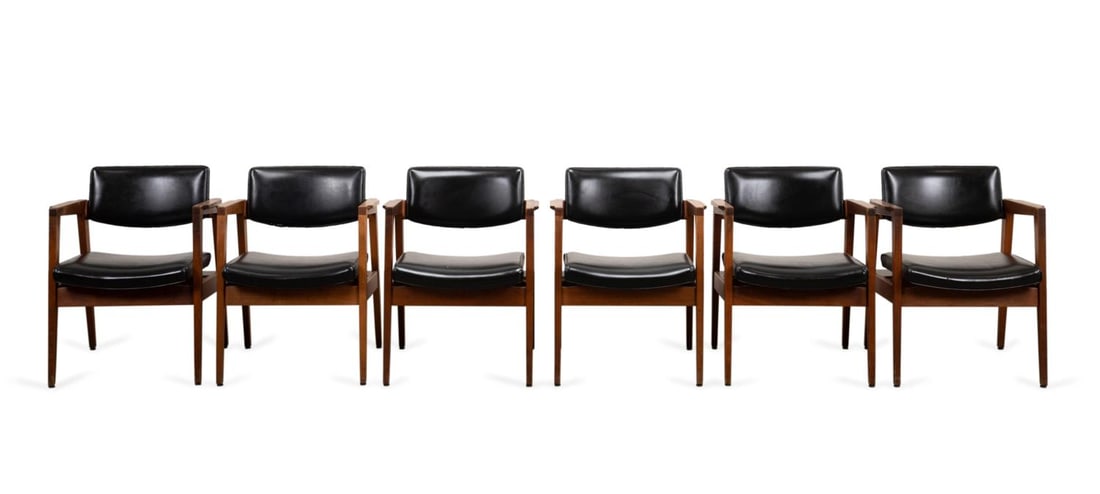 6 GUNLOCKE & CO. MODERN WALNUT & FABRIC ARMCHAIRS: The Gunlocke Company Inc (American). Mid century modern walnut and black vinyl dining chairs, marked to underside of seat and copper inlaid tag to upper back leg. Approximate dimensions: h. 30.75", w.