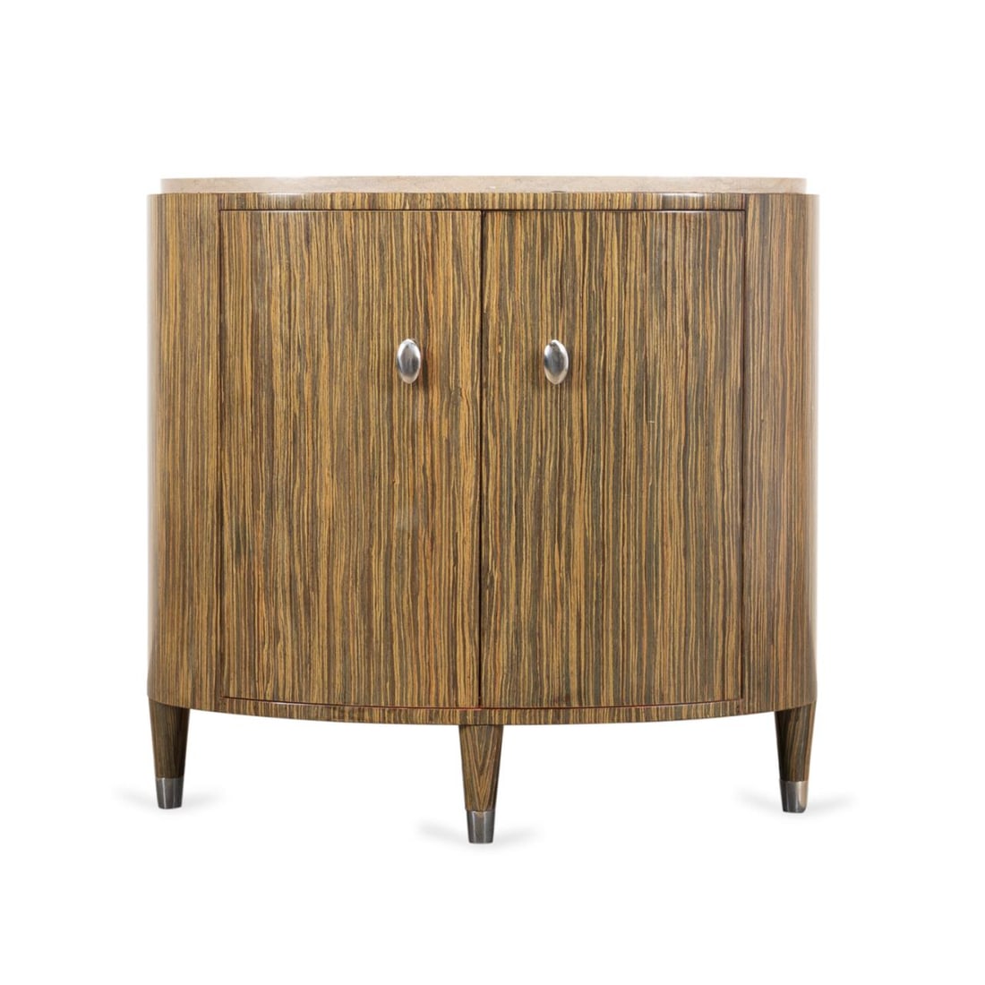 MODERN OVAL ZEBRAWOOD VENEER CABINET: Modern oval Zebrawood veneer cabinet, having a marble top, double drawers, and rising on tapered legs, apparently unmarked. Provenance: From the Private Collection of Bruce Anderson, Winston-Salem, No
