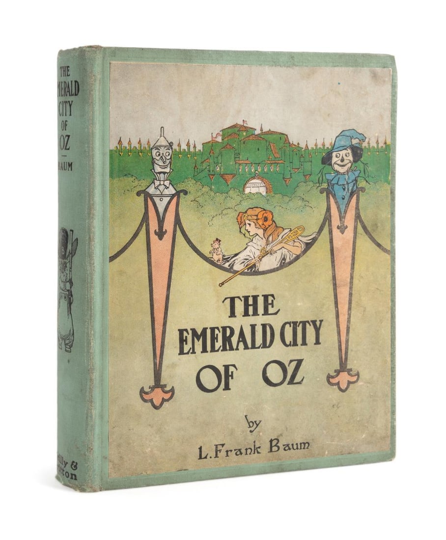 L. FRANK BAUM 'THE EMERALD CITY OF OZ' EARLY ED.: 'The Emerald City of Oz' by L. Frank Baum, printed 1910 by Reilly and Britton, early edition listing 11 titles on the advertisement pag, bound in publisher's green cloth with pictorial front board,8vo