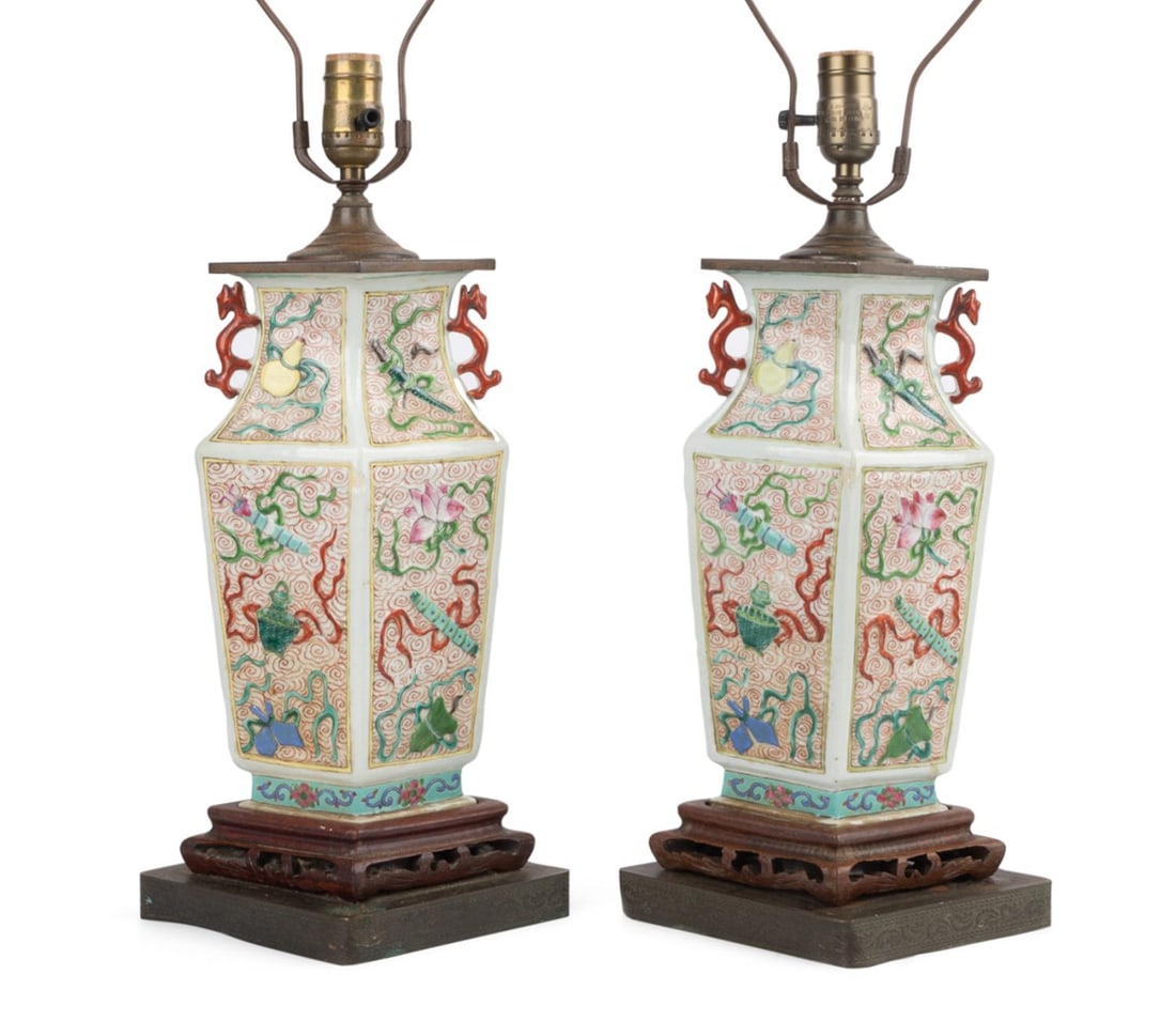 PAIR CHINESE BOGU VASES MOUNTED AS LAMPS: Chinese. Pair of Famille Rose lozenge form porcelain vases, now mounted as lamps, each having applied dragon handles, and decorated with Bogu (Precious Objects) set amongst swirling clouds, not examin