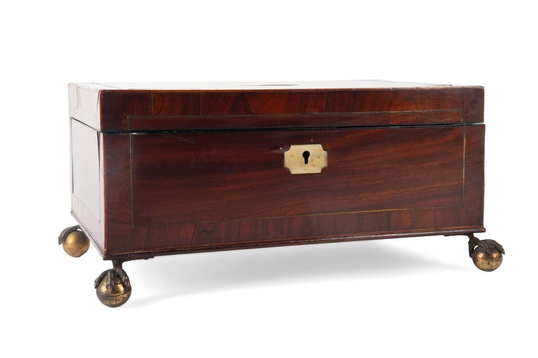 GEORGE IV BRASS INLAID MAHOGANY WORK BOX, C. 1829: English, circa 1829. George IV brass inlaid mahogany veneer work box, having a inset silver monogrammed plaque with the date of 1829, mirror to the lid, fitted interior, and rising on ball and claw fe