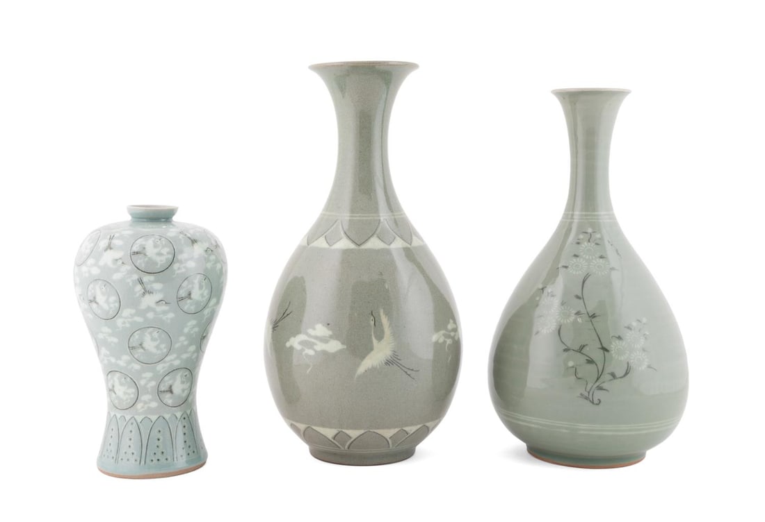 3PCS KOREAN CELADON GLAZED VASES: Korean. Three celadon vases, comprising one pear-shaped vase with flying crane motifs with Hanja mark to the underside; one pear-shaped vase with floral motifs, apparently unmarked; and one plum vase