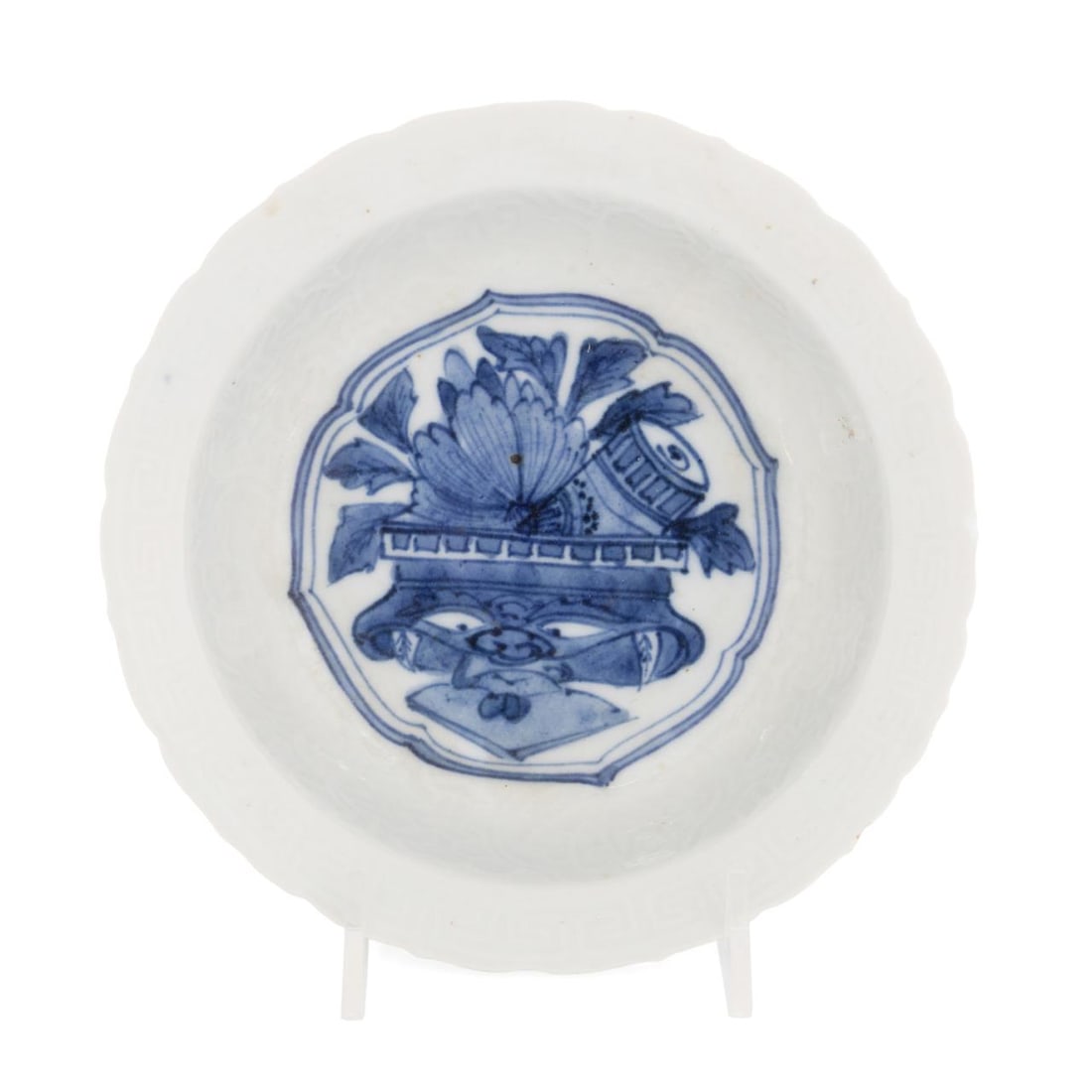 JAPANESE SMALL BLUE AND WHITE HIRADO BOWL: Japanese, Late Edo Period. Blue and white porcelain Hirado bowl, with scalloped edge, incised decoration, center lotus motif, label to back from Sotheby's and Stone Lantern, Highlands, N.C. Approximat