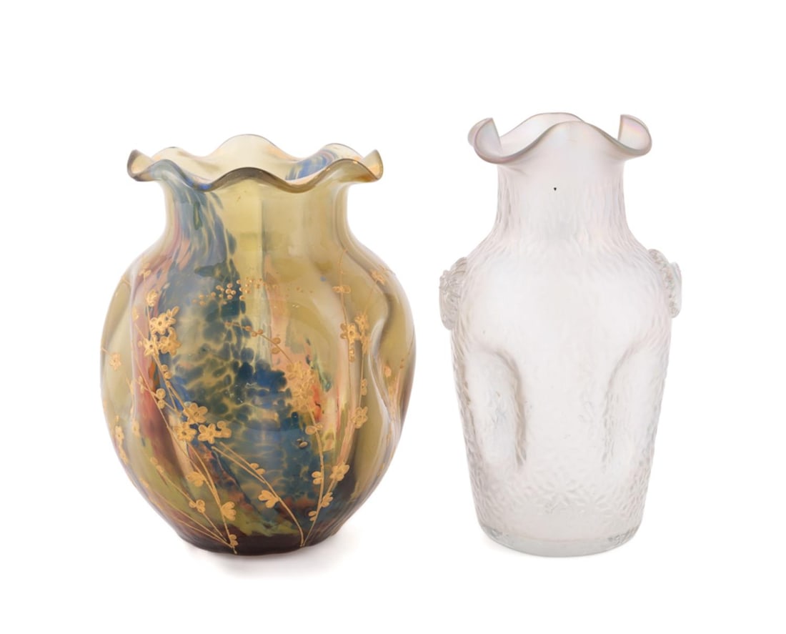 TWO BOHEMIAN LOETZ STYLE ART GLASS BUD VASES: Bohemian, early 20th century. Two small Loetz style glass bud vases comprising one yellow shaped vase with blue and red splashes of color and gold Japonisme floral motif, and one iridescent colorless