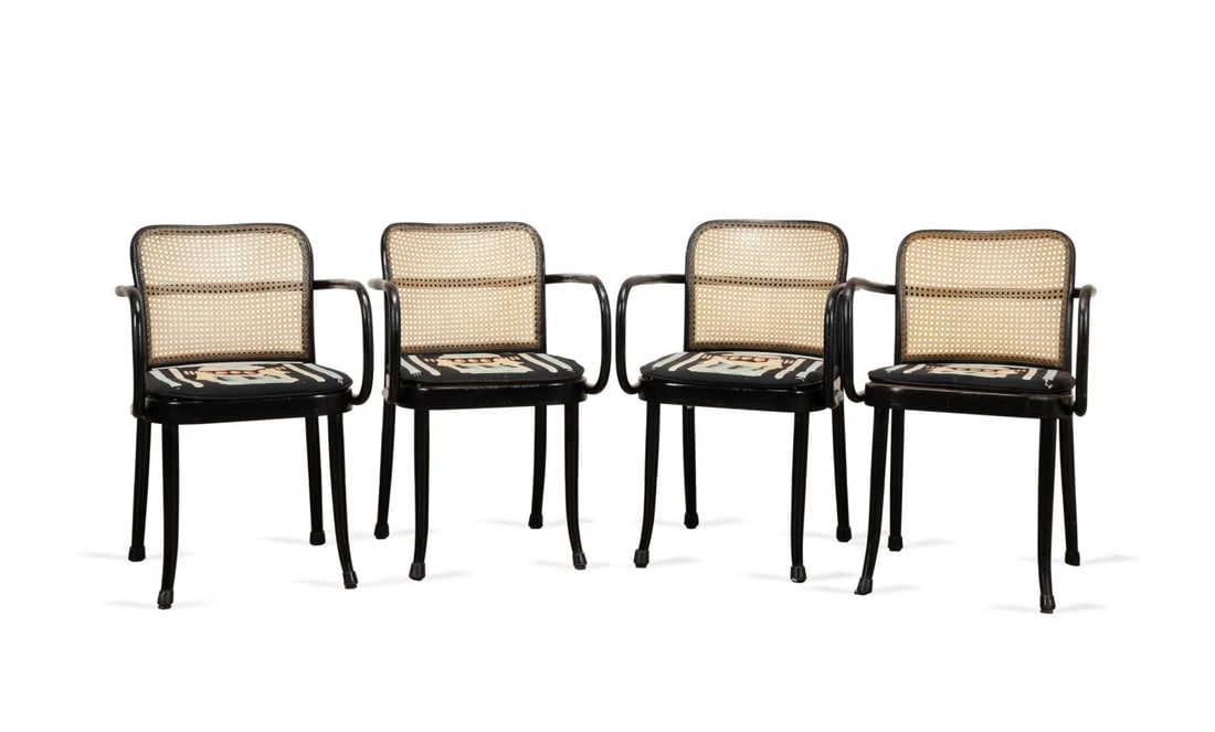 4 STENDIG 'PRAGUE' EBONIZED ARMCHAIRS W/ CUSHIONS: Joseph Hoffman for Stendig, mid 20th century. Set of four ebonized 'Prague' or 811 (A811/F) bentwood and caned arm chairs, with 'Venturi' style Sheraton pattern needlepoint cushions, a few retaining o