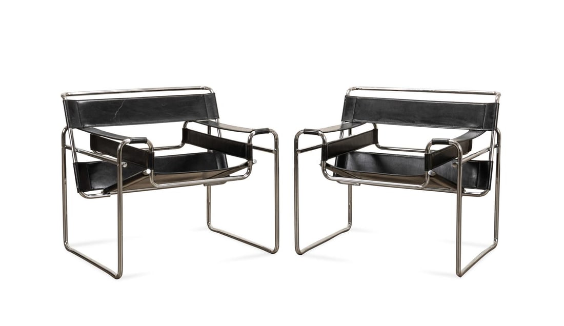 PAIR, MARCEL BREUER 'WASSILY' BLACK LEATHER CHAIRS: Marcel Breuer (Hungarian / German, 1902-1981) for Knoll (American), second half 20th century. Pair of 'Wassily' black leather and tubular chromed steel chairs, apparently unmarked. Provenance: Private