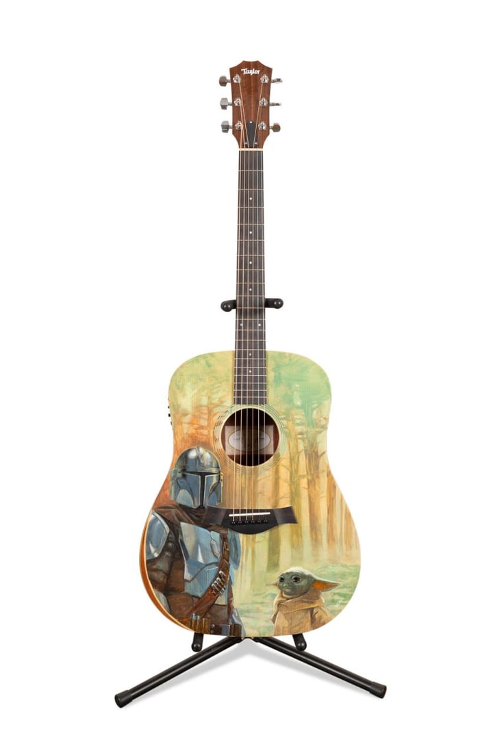 LEE KOHSE PAINTED STAR WARS MOTIF TAYLOR GUITAR: Lee Kohse (American, born 1974). Taylor 10e dreadnought acoustic-electric guitar with the soundboard hand painted with a one of a kind Star Wars theme featuring Grogu and Mandalorian, in a Taylor case