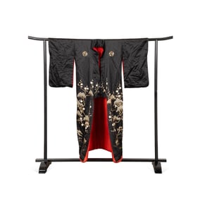 BLACK AND RED FORMAL KIMONO ON DISPLAY RACK