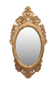 BAROQUE STYLE OVAL GILTWOOD MIRROR