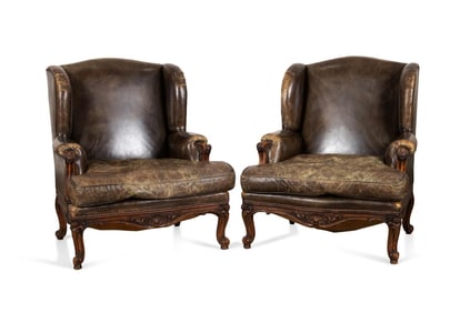 PAIR, EARLY 20TH C. LEATHER BERGERE WING CHAIRS