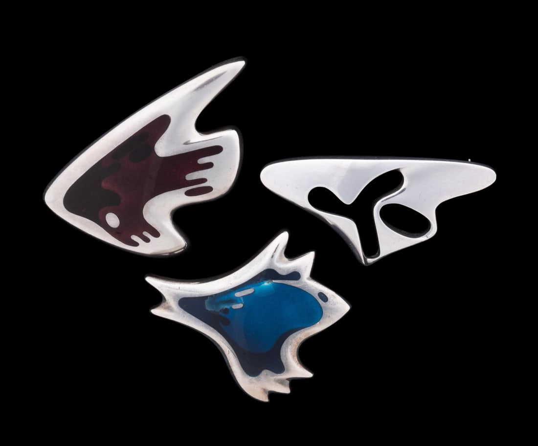 HENNING KOPPEL FOR GEORG JENSEN, 3 BROOCHES: Henning Koppel (Danish, 1918-1981) for Georg Jensen (Danish, founded 1904). Three sterling silver and enamel organic form pins, comprising model numbers 307 in brown enamel, 306 in blue enamel, and 32