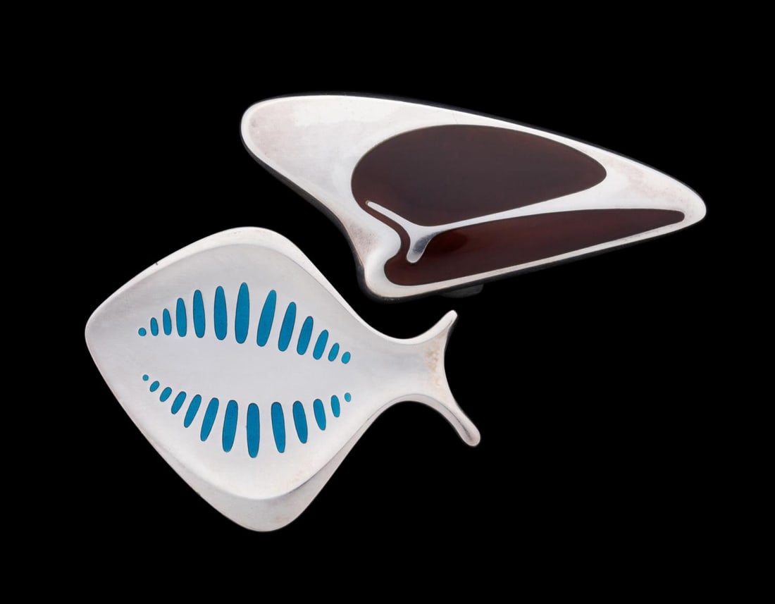 2 HENNING KOPPEL FOR JENSEN ENAMEL PINS, INCL FISH: Henning Koppel (Danish, 1918-1981) for Georg Jensen (Danish, founded 1904). Two modernist sterling silver and enamel brooches, comprising model numbers 343 the "fish" in blue enamel and 314 in brown e