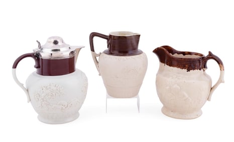 THREE ENGLISH STONEWARE JUGS, ONE STERLING MOUNT