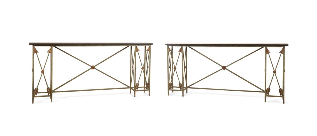 PAIR OF NEOCLASSICAL STYLE GRANITE TOP CONSOLES: Possibly American, 20th century. Pair of arrow motif console tables in the Neoclassical taste, each having a granite top, and verdigris finish, having an auction label but otherwise apparently unmarke