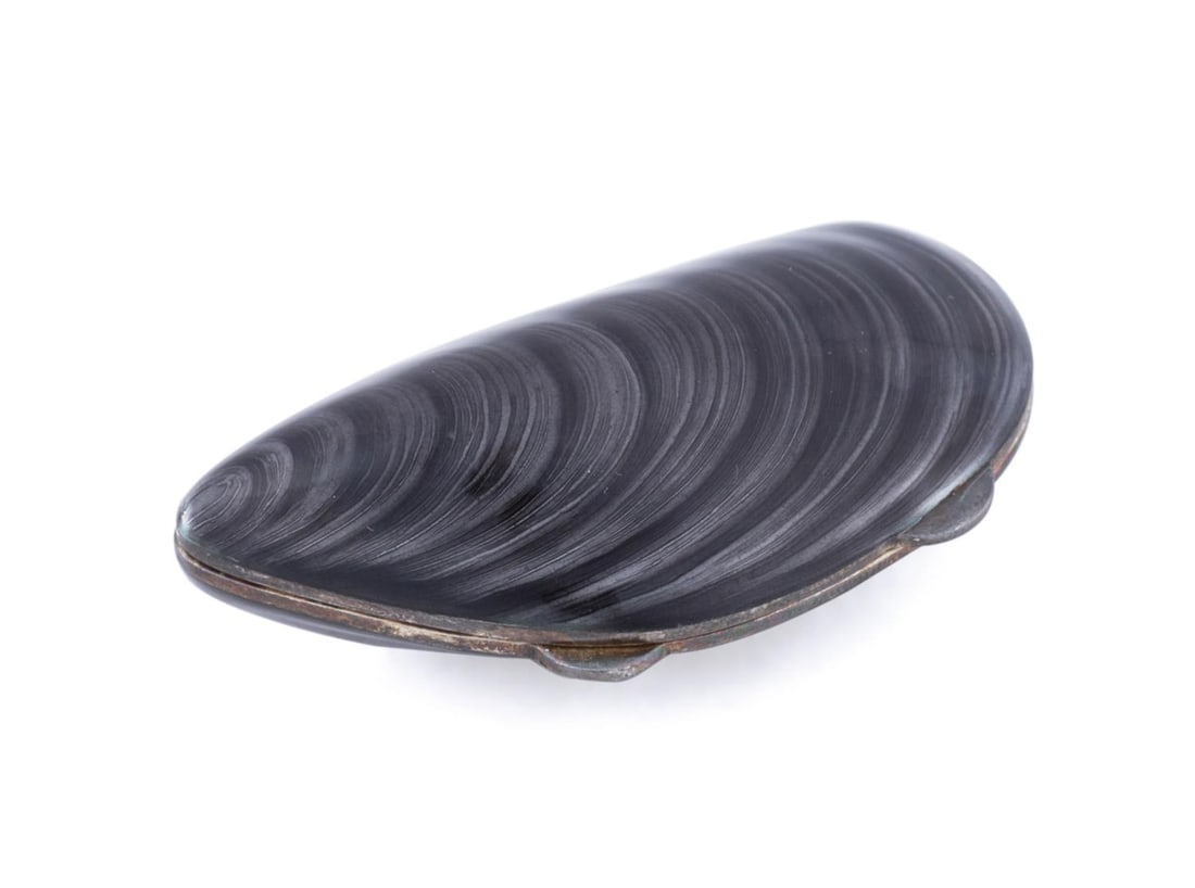 TIFFANY ENAMEL AND STERLING MUSSEL SHELL PILL BOX: Tiffany & Co. Gray enameled naturalistic mussel shell pill box. Marked to inner rim "Italy", "925 "Tiffany & Co." and "536 Fl" beside a star within a cartouche, additionally marked "30" at the point o