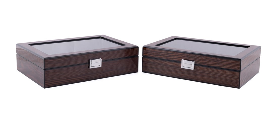 PAIR OF EBONY VENEER TEN-WATCH CASES: Pair of ebony veneer ten-watch cases or boxes, each having a glass panel to the lid, apparently unmarked. Provenance: Private Collection, Atlanta, GA. Approx dimensions: h. 3.25", w. 11.5", d. 8.25".