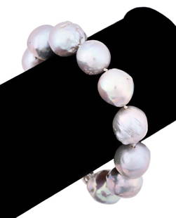 LIGHT GRAY BAROQUE PEARL BRACELET, 8": Gray iridescent baroque pearl bracelet, having (11) strung pearls of various sizes and a silver tone clasp. Apparently unmarked. Provenance: Private Collection, Atlanta, GA. Approx dimensions: l. 8";