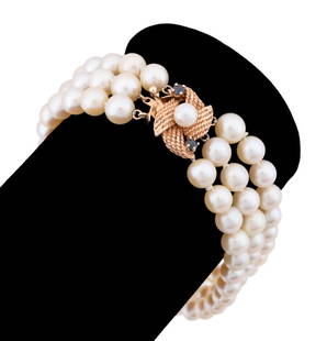TRIPLE STRAND CULTURED PEARL 14K YG BRACELET: Three strand graduated white pearl bracelet with a 14k yellow gold and blue gemstone rope motif clasp. Marked "14k" and "IPS" to clasp. Provenance: Private Collection, Atlanta, GA. Approx dimensions: