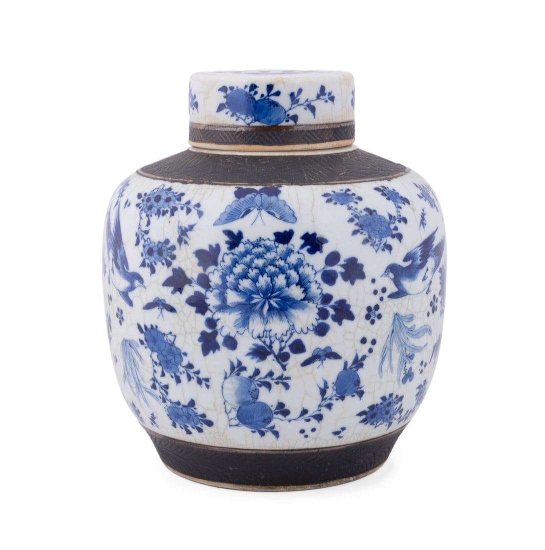 CHINESE BLUE & WHITE LIDDED GINGER JAR: Chinese, 20th century. Blue and white ginger jar with cover, in crackle glaze with iron bone clay banding, decorated with birds, butterflies, fruit, and flowers, apparently unmarked. Approximate dimen