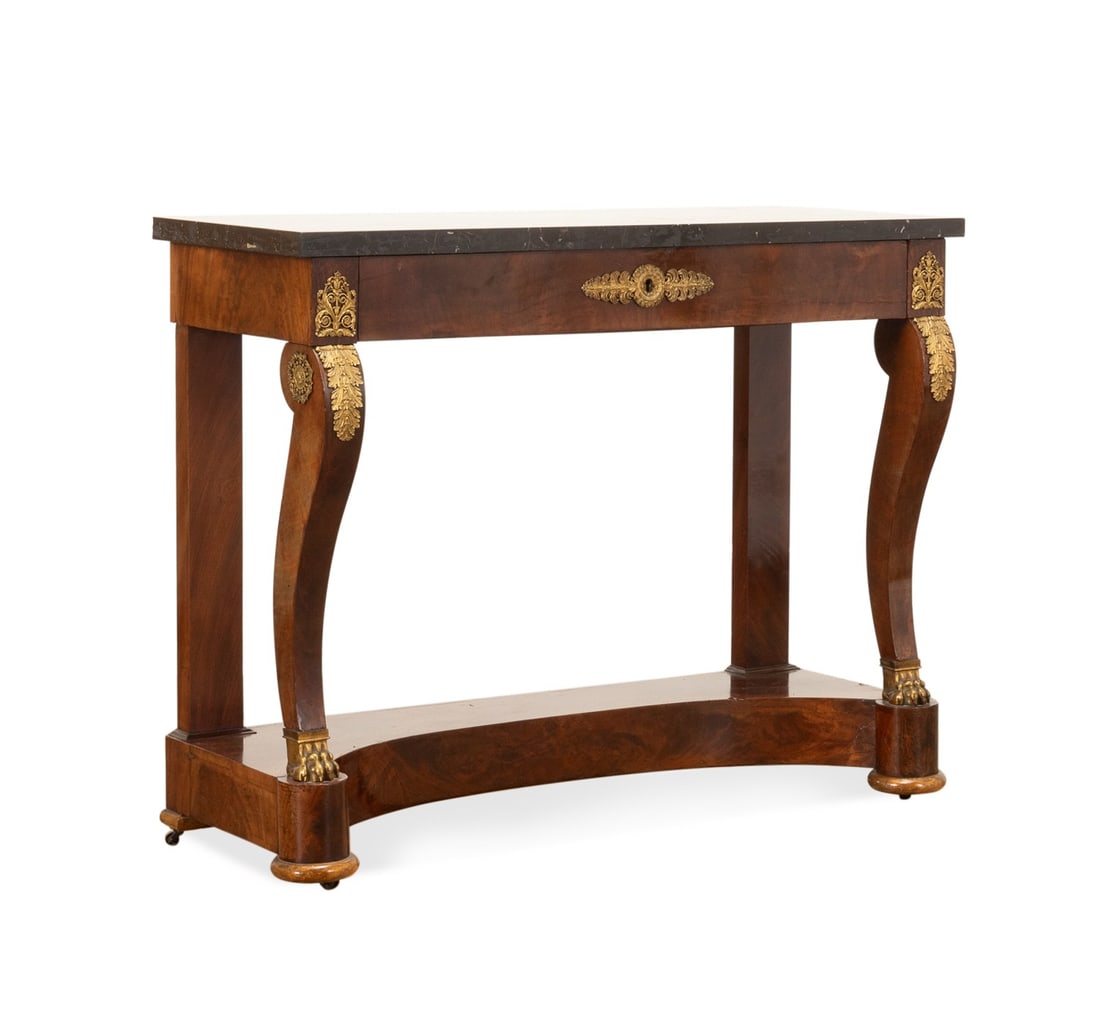 19TH C. RESTORATION MAHOGANY CONSOLE TABLE: French, 19th century. Empire / Restoration ormolu mounted mahogany and mahogany veneer console or pier table, having a marble top, frieze drawer, and rising on front curved legs with paw feet on conca