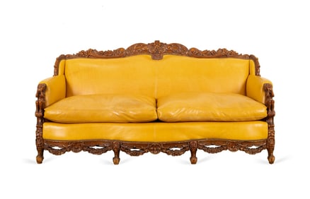 HEAVILY CARVED ROCOCO STYLE LEATHER SOFA