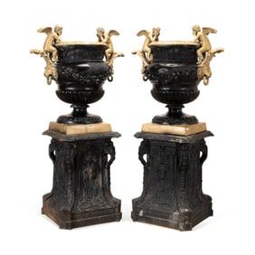PAIR OF BRONZE GARDEN URNS ON CAST IRON BASES