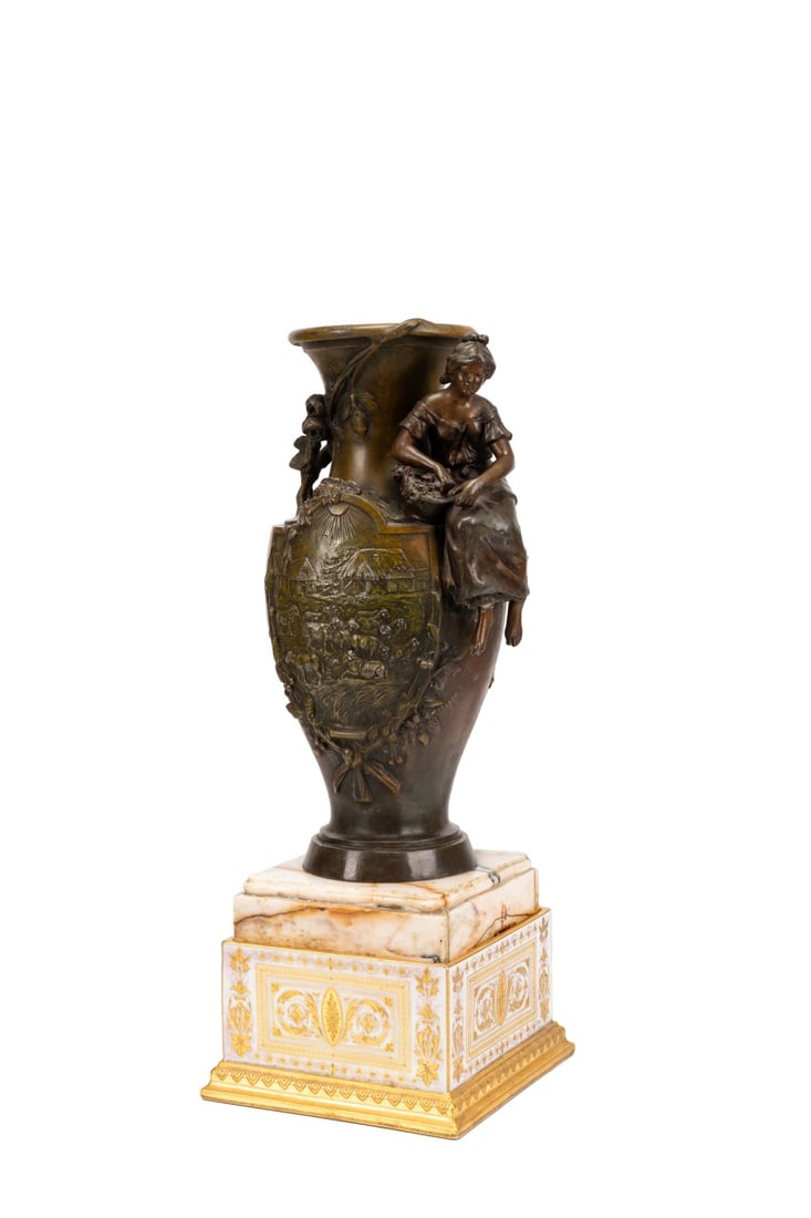 PATINATED URN ON MARBLE BASE, AFTER H. F. MOREAU: After Hippolyte Francois Moreau (French, 1832-1926), late 19th to early 20th century. Bronze patinated spelter urn, having the figure of a farm girl and reserves decorated with rural farm scenes, on m