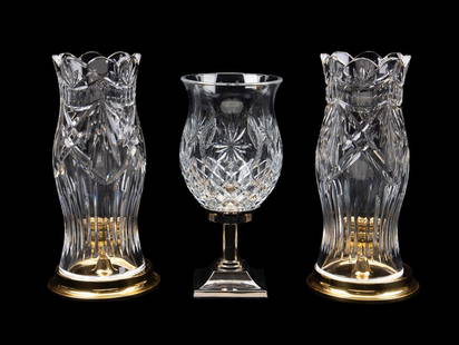 THREE WATERFORD CRYSTAL CANDLE HURRICANES: Waterford Crystal. Group of three colorless crystal candle hurricane lamps comprising, a pair of America's Heritage collection "Thomas Jefferson" lamps with brass bases, and a "Time Square Hope For Ab