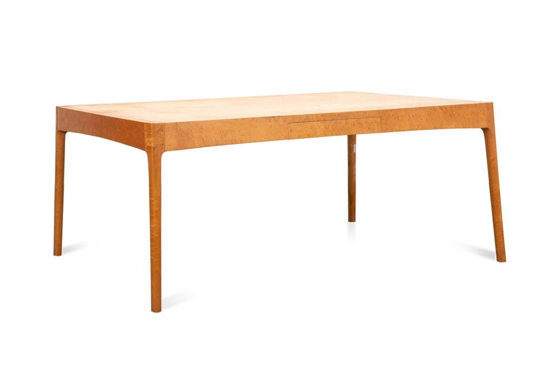 ROBERT ERICKSON BIRDS EYE MAPLE DESK, 1991: Robert Erickson (American, born 1947), 1991. Studio benchmade birdseye maple desk or dining table, having a single drawer, and rising on splayed legs, signed to the underside of the drawer. Provenance