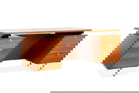 GEORGE NELSON FOR HENRY MILLER 'EOG' DESK, C. 1960: George Nelson (American, 1908-1986) for Herman Miller (American, founded 1920), circa 1960. Walnut veneer "EOG" desk, having a floating top, three-drawers, one file drawer, and rising on tubular chrom