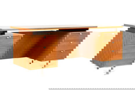 GEORGE NELSON FOR HENRY MILLER 'EOG' DESK, C. 1960: George Nelson (American, 1908-1986) for Herman Miller (American, founded 1920), circa 1960. Walnut veneer "EOG" desk, having a floating top, three-drawers, one file drawer, and rising on tubular chrom
