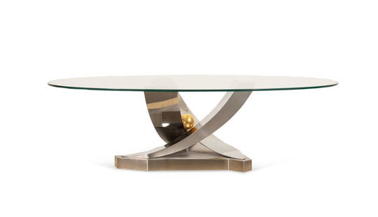 GREG SHERES 'GIVERNY' COCKTAIL TABLE, 63/100: Greg Sheres (American, founded 1989), last quarter 20th century. Modern oval glass top "Giverny" cocktail table having a polished steel and 24k gold plated base, signed to the plaque and numbered 63 o