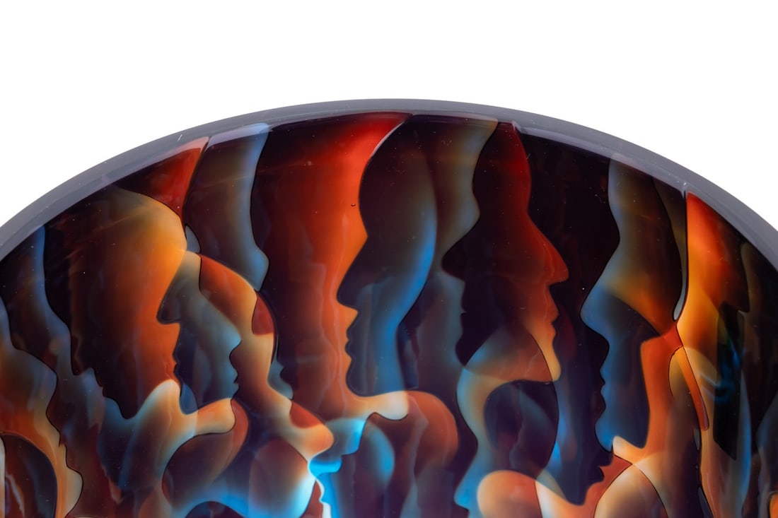 KEVIN GORDON 'CONFLUENCE' PROFILE PATTERN VASE: Kevin Gordon (Norwegian / Australian, born 1968). "Confluence" - 2006, blown glass with engraved overlay depicting profiles of people, signed "K. Gordon", titled, and dated to underside. Note: Acquire