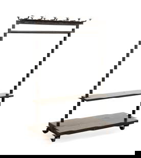 INDUSTRIAL STEEL CLOTHING RACK, RALPH LAUREN ASSET: American, 20th century. Black industrial rolling clothing rack, having large steel stakes for hangers, single bar, two shelves, and raised on wheels, no apparent maker's mark. Note: Previously used