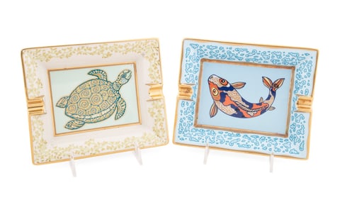 HERMES, PAIR OF PAINTED PORCELAIN ASHTRAYS