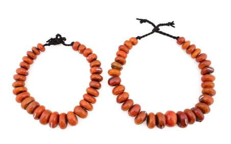 TWO COPAL AMBER BEADED STRANDS WITH SILVER INLAY