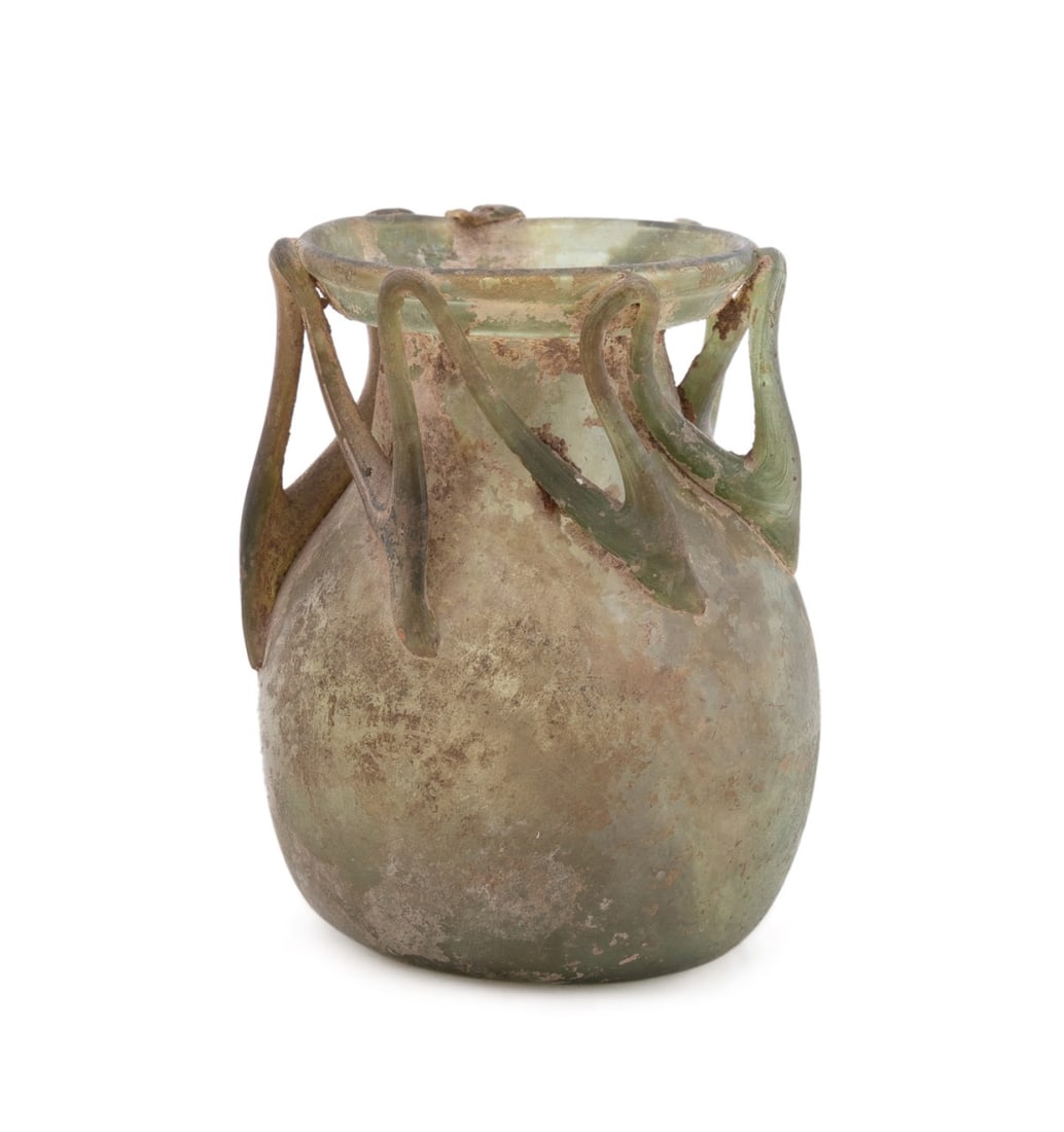 ANCIENT ROMAN BULBOUS GLASS JAR WITH THREADS: Roman, circa 3rd-4th century AD. Small bulbous glass jar with unusual glass threading between rim and shoulder, apparently unmarked, label for M.S. Rau, Inc. Antiques, New Orleans, LA to underside. No