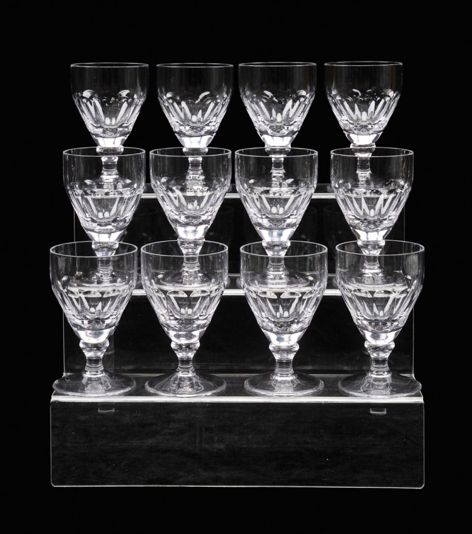 WILLIAM YEOWARD, 12 'IONA' SMALL WINE GLASSES: William Yeoward (English, founded 1995). Set of 12 crystal "Iona" small wine glasses, each rising on a round foot, all marked appropriately to underside. Provenance: Private Collection of Alton Arnall
