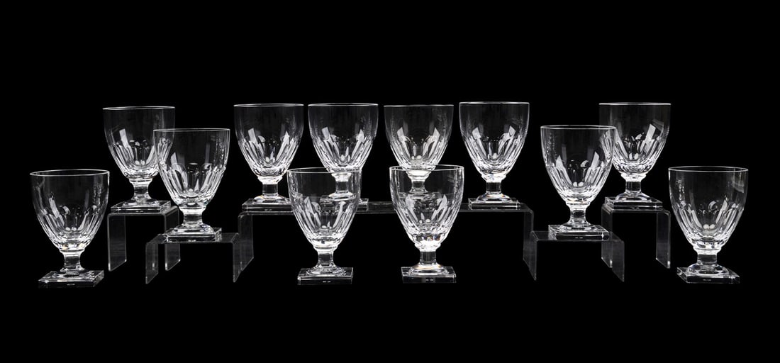 WILLIAM YEOWARD, 12 PIECES OF 'CAROLINE' STEMWARE: William Yeoward (English, founded 1995). Set of 12 pieces of crystal "Caroline" stemware comprising 9 water goblets and 3 claret wine glasses, each rising on a square foot, all marked appropriately to