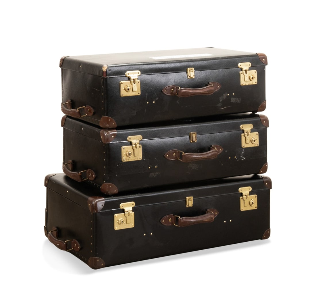 THREE GLOBE-TROTTER 2-TONE LEATHER SUITCASES: Globe-Trotter (English, founded 1897). Group of three "Original" two-wheel trolley suitcases constructed of compressed paper with leather trim, gold tone hardware, plaque to interior and stamped to ou