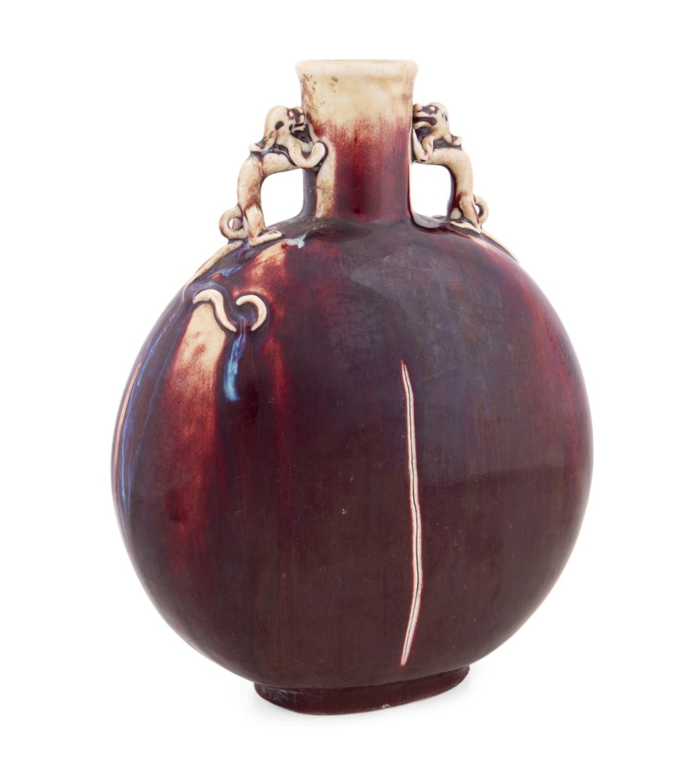 CHINESE FLAMBE GLAZED MOON FLASK VASE: Chinese. Flambe glazed porcelain moon flask, having two beast-form handles, underside with Qianlong mark. Approximate dimensions: h. 13", w. 10", d. 5".