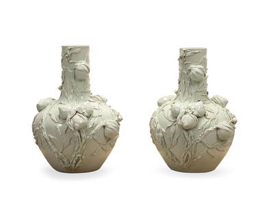 PAIR OF LARGE 'NINE PEACHES' BLANC DE CHINE VASES: Chinese. Pair of large "Nine Peaches" Blanc de Chine glazed porcelain Tianqiuping or bottle form vases with high relief fruit and foliate decoration, underside with six-character reign mark of Qianlon
