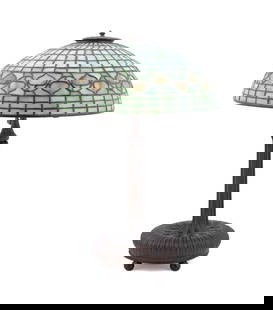 TIFFANY STUDIOS ACORN LEADED GLASS TABLE LAMP: Tiffany Studios (American, 1880-1930), circa 1900. "Vine" / "Acorn" leaded glass shade and "260" three-socket patinated bronze base table lamp, domed shade having mottled green glass geometric body wi