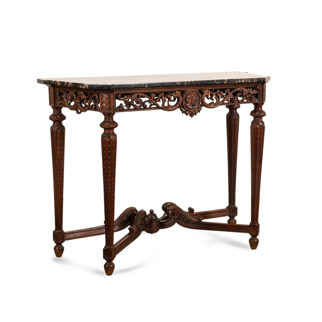 ITALIAN RENAISSANCE REVIVAL MARBLE TOP CONSOLE: Italian, late 19th to early 20th century. Carved walnut Renaissance Revival console table, having a black porto nero marble top, pierced frieze with mythical beasts centering on a profile medallion, a