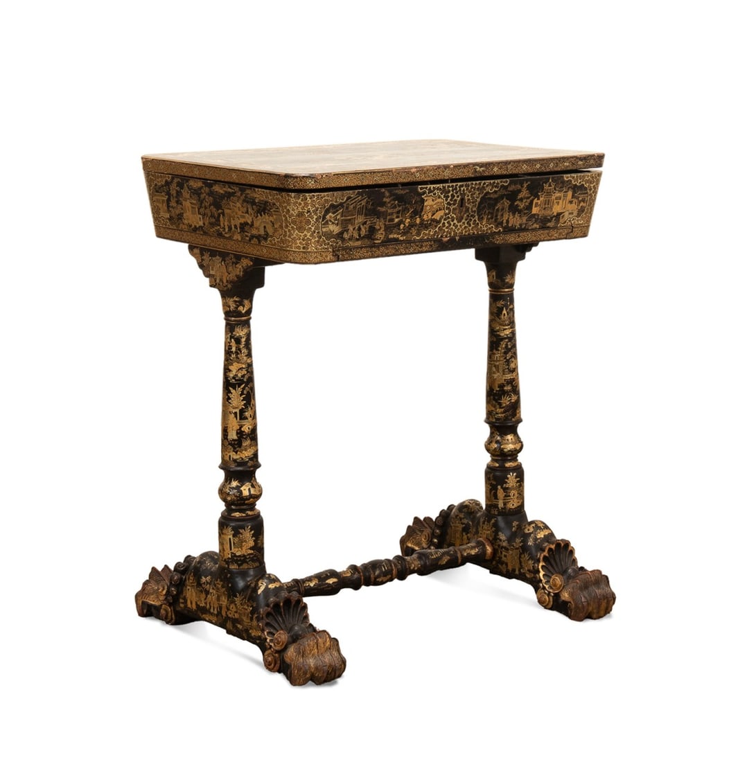 19TH C. CHINESE EXPORT LACQUER & GILT SEWING TABLE: 19th century Chinese Export gilt lacquer sewing table, with a hinged lid, fitted interior with bone sewing accessories, basket frame slide, and raised on turned legs and hairy paw feet, apparently unm