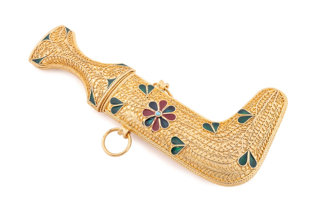 GOLD PLATED & ENAMELED JAMBIYA IN PRESENTATION BOX: Saudi Arabian, 20th century. Ceremonial gold plated and enameled Jambiya in original green velvet presentation box having the royal coat of arms on the top. Provenance: Private Collection, Alpharetta,