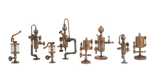 8 LARGE VINTAGE ENGINE OILERS MOUNTED ON STANDS
