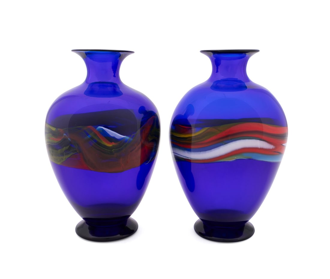 VERSACE FOR ARCHIMEDE SEGUSO, PAIR OF VASES, 1990S: Gianni Versace / Versace (Italian, founded 1978), for Archimede Seguso (Italian, founded 1947),1990s. Pair of blown Murano cobalt blue glass vases, each having a multicolored murrine band, retaining a