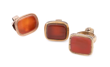 THREE CARNELIAN MOUNTED GOLD PLATED WATCH FOBS