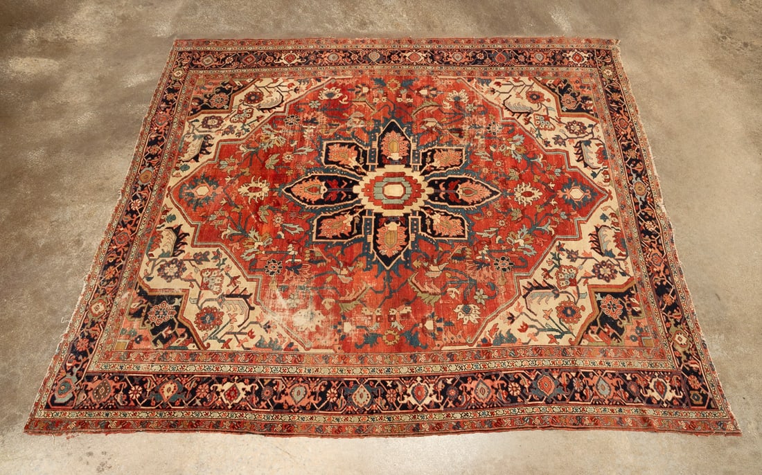 LARGE HAND-KNOTTED PERSIAN SERAPI: Persian, early 20th century. Hand-knotted Serapi rug featuring a palette of red, blue, bone, and a touch of bister. Apparently unsigned. Approximate dimensions: l. 11'10", w. 10'